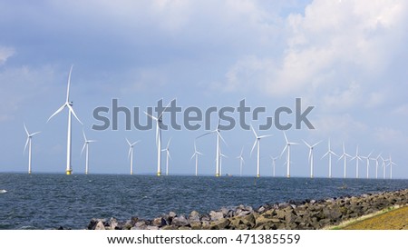 Windmill park Westermeerwind the largest wind farm in the Netherlands. 
The wind farm produce 1.4 TWh of electricity annually, enough to provide electricity to over 400,000 households.Urk,Netherlands Royalty-Free Stock Photo #471385559