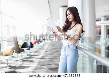 Modern business woman in the office with tablet