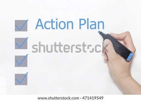 A hand with a marker writing 'Action Plan'.