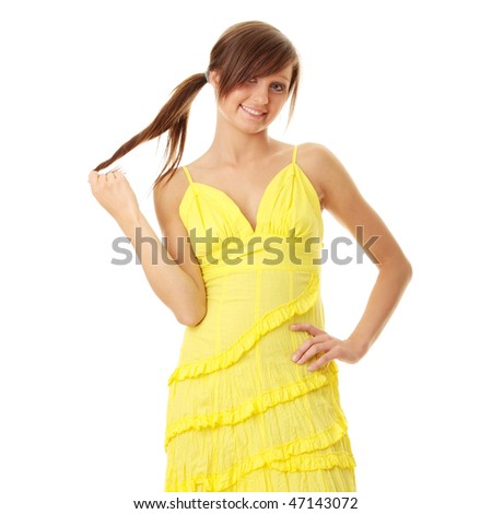 Beautiful brunette girl in yellow dress. Isolated on white background