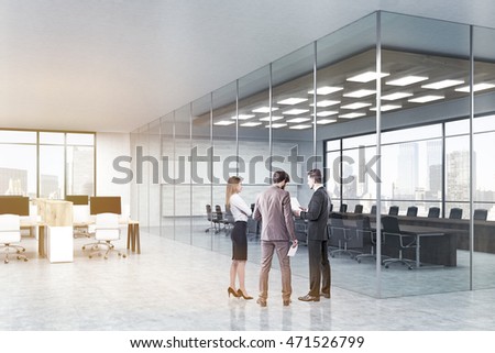 Team of colleagues are standing in hall near conference room with glass walls and discuss work issues. Concept of teamwork. 3d rendering, mock up, toned image