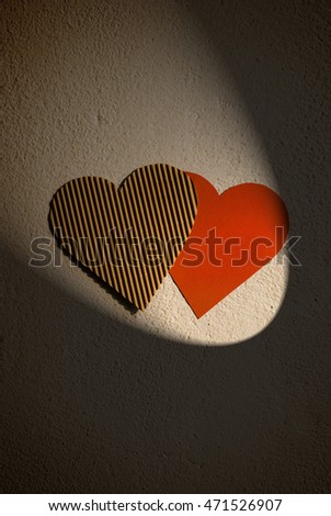 Paper hearts hanging on the wall   