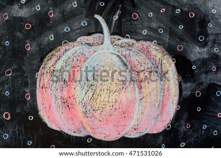 painted with chalk colored pumpkin and circles on black background