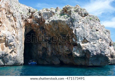 Rock caves and cristal water coastline landscape in Salento, Apulia, Italy