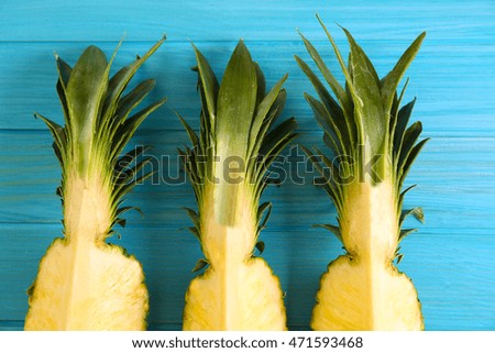 Pineapple slices on blue background