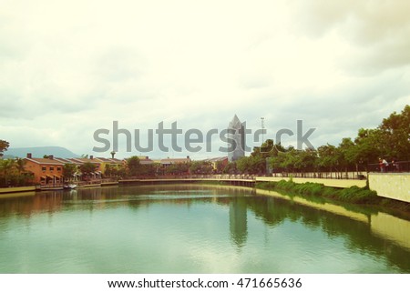 Old cityscape from a River park with blue sky