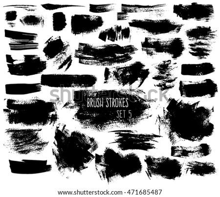 Expressive ink spots of black color on white background. Different brush strokes and shapeless scribbles. Isolated decorative elements for banners.