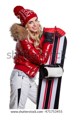 model wearing snowboard suit holding a snowboard in studio