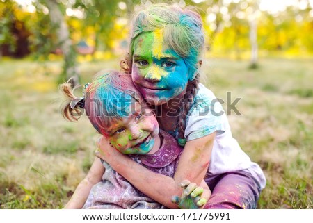 portrait of the sisters, painted in the colors of Holi.