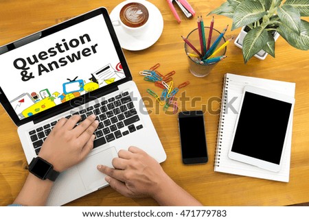 Q&A - Question and Answer Male person sitting front open laptop computer and smart phone with blank empty screen for your information or content,modern businessman work, top view