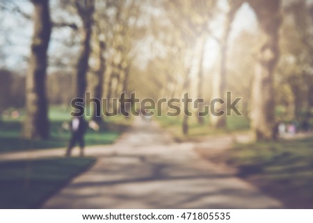 Blurred Background of People Walking in the Park