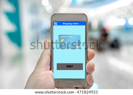 Payment now on shopping online e-business website at smartphone screen in hand, e-business and technology concept