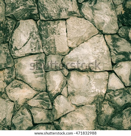 pattern  retro color of modern style design decorative uneven cracked real stone wall surface with cement