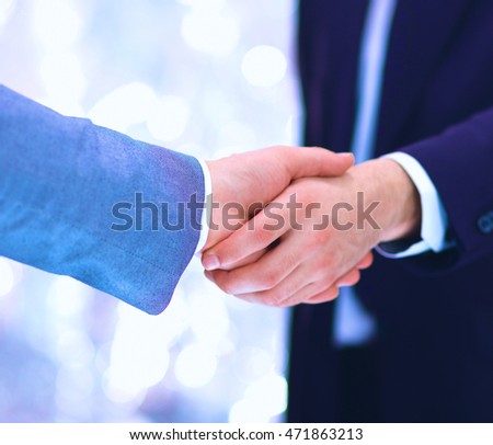 Businessmen shaking hands, isolated on white. 