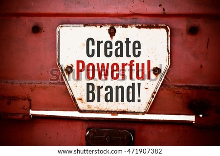 Create Powerful Brand! concept written on a grunge iron signboard