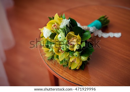 Yellow wedding bridal bouquet on table