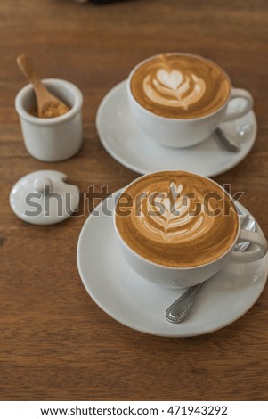 Defocused and blurred image for background of latte art with different kinds of sugar on wooden table