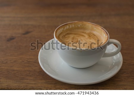 Defocused and blurred image for background of latte art with different kinds of sugar on wooden table