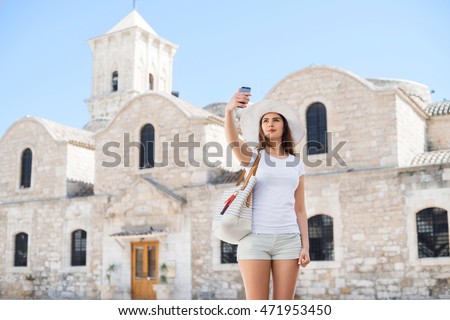 Teenage girl taking selfie. Young and beautiful woman have a weekend in Larnaca. Vacation, holidays and traveling concept.