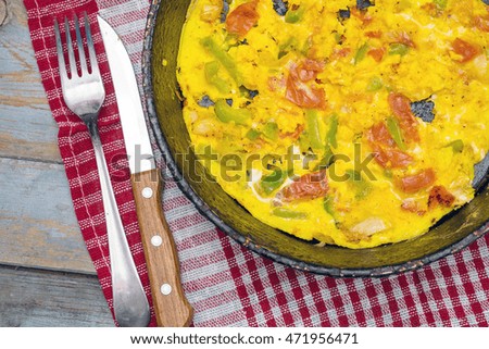 Omelet with vegetables in pot. Top View