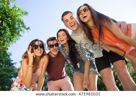 Happy friendship concept with young people having fun together