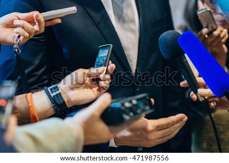 Media interview with politician or business person. Royalty-Free Stock Photo #471987556