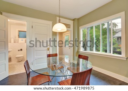 Modern Dining table view and metal chairs with wooden seats. bathroom view. Northwest, USA