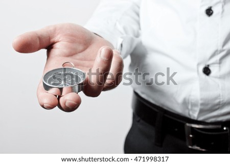 Businessman with a compass holding in hand