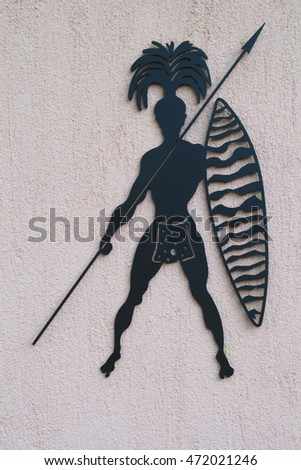 African Style Men toilet sign on Gray wall
