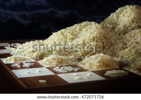 chessboard with growing heaps of rice grains, legend metaphor of exponential function and unlimited growth, dark sky with copy space, selected focus, narrow depth of field Royalty-Free Stock Photo #472071736
