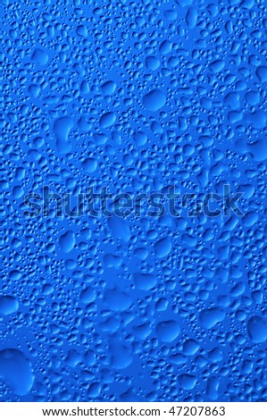 blue water bubbles on the window for background