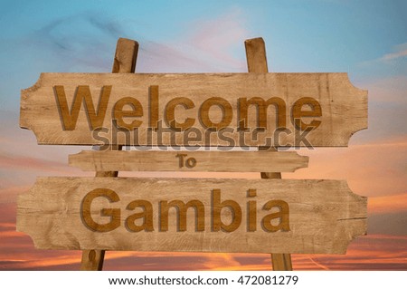 Welcome to Gambia sing on wood background 