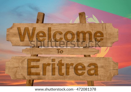 Welcome to Eritrea sing on wood background with blending national flag