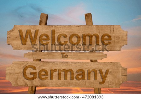 Welcome to Germany sing on wood background 