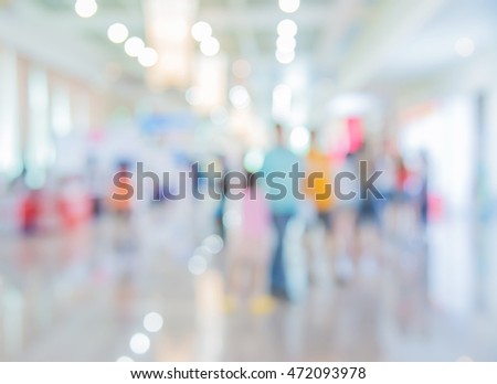 Abstract blurred people at shopping mall with light bokeh background