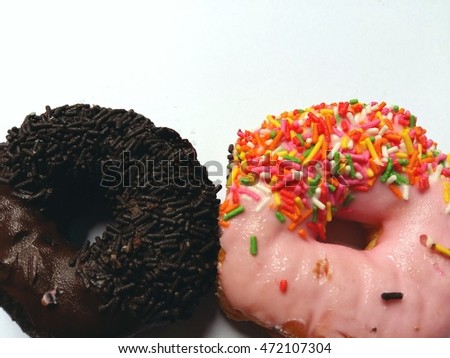 Chocolate and strawberry donuts so delicious on white background 