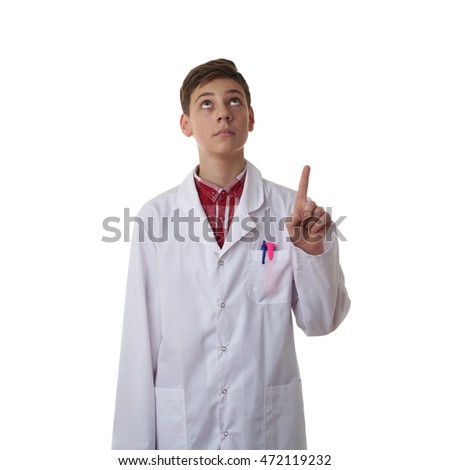 Cute teenager boy wearing white lab medic coat pointing up over white isolated background as science, medicine, healthcare concept