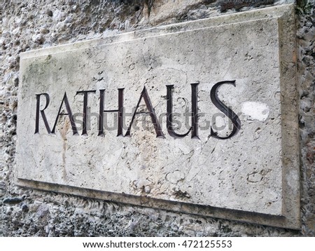 Town hall (Rathhaus) stone sign on wall.