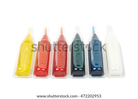 Food dye liquid coloring in a capsule blister pack isolated over the white background
