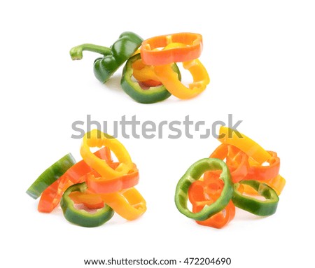 Colorful pile of green, orange, yellow bell pepper slices isolated over the white background, set of three different foreshortenings