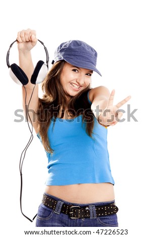 Beautiful and happy young girl holding headphones, isolated on white