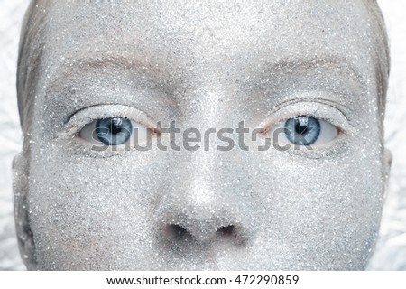 Beautiful, amazing portrait of two woman. Unreal make up like a space. Closeup shooting in studio with silver background. Emotion, posing of model. silver glitter.