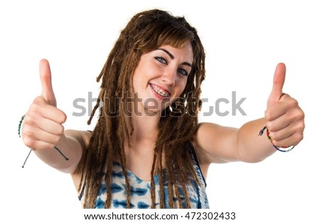 Girl with dreadlocks with thumb up