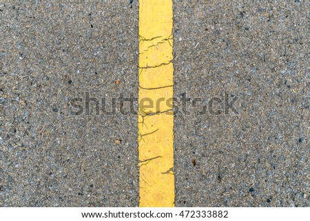 Asphalt road with yellow line texture
