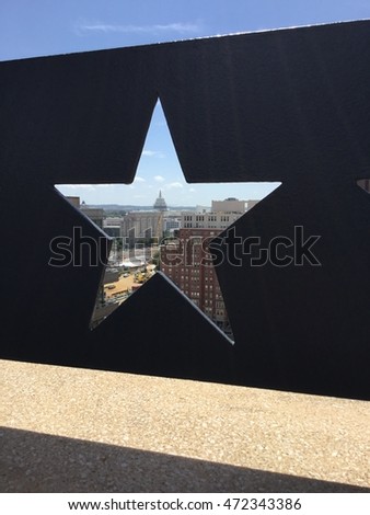 View of Capitol Hill through a star cutout on a roof