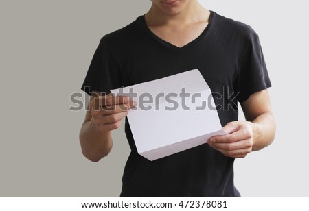 Man reading blank white flyer brochure booklet. Leaflet presentation. Pamphlet hold hands. Man show clear offset paper. Sheet template.