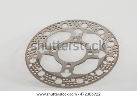 Old disc brake for motorcycle on white background