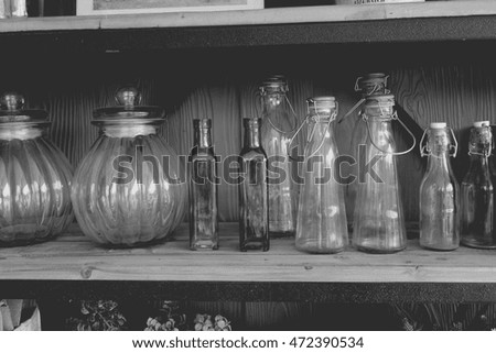 vintage glass bottle in wooden box on shelf