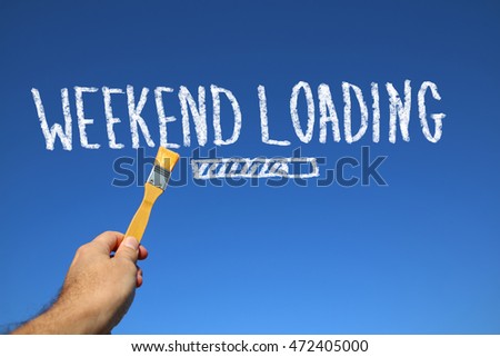 man hand holding paint brash in front of blue sky with the text weekend loading.