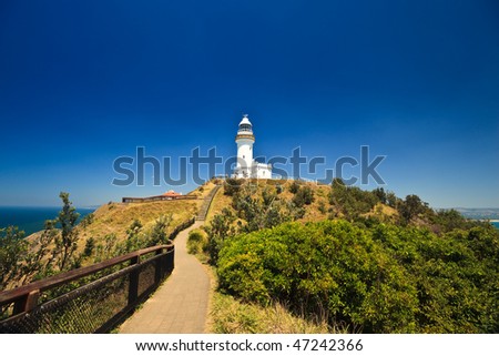 Scenic Hill Approaching White Byron Bay Lighthouse Royalty-Free Stock Photo #47242366